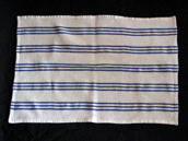 White teatowel with vertical blue stripes