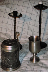 pewter: goblet, tankard; iron: two different candlesticks